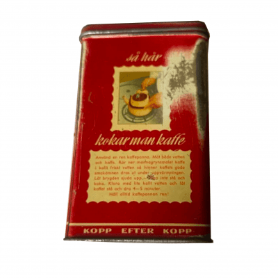 Gammal röd kaffeburk i plåt med texten Kopp efter kopp